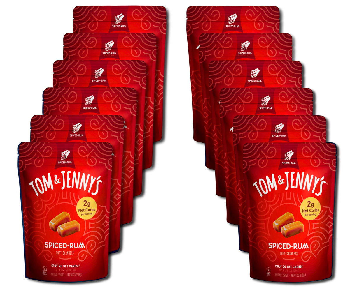 Twelve red Tom & Jenny's Spiced-Rum caramel pouches arranged in two staggered columns on a plain white background.