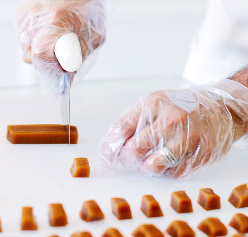 Tom hand cutting rich brown, soft salted caramel