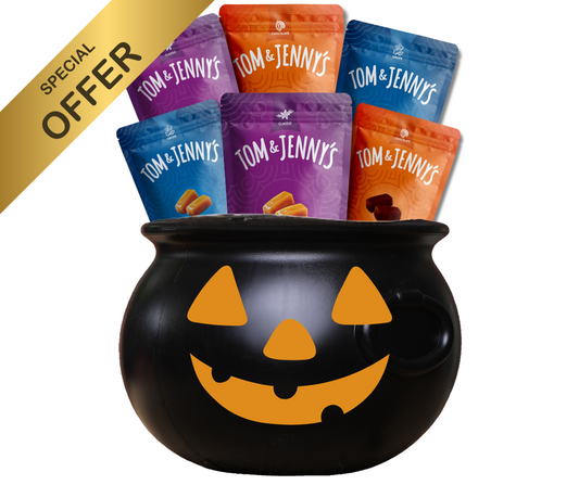 Image showing the Halloween Bundle. It says "Special Offer" in the top left. There are 6 bags of assorted Tom & Jenny's flavors inside of a black cauldron with an orange jack-o-lantern face.