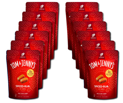Twelve red Tom & Jenny's Spiced-Rum caramel pouches arranged in two staggered columns on a plain white background.