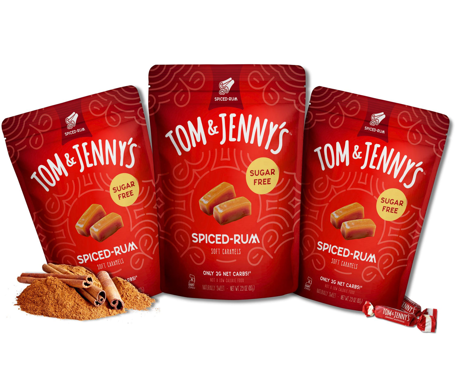 Three packages of Tom & Jenny's spiced rum soft caramels on a white background with cinnamon in the bottom left
