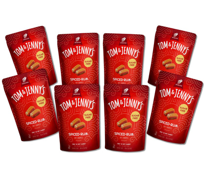 8 packages of Tom & Jenny's Spiced Rum caramels on a white background