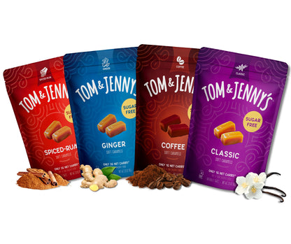 One bag each of Classic, Coffee, Ginger, and Spiced Rum Tom & Jenny's soft caramels on a white background