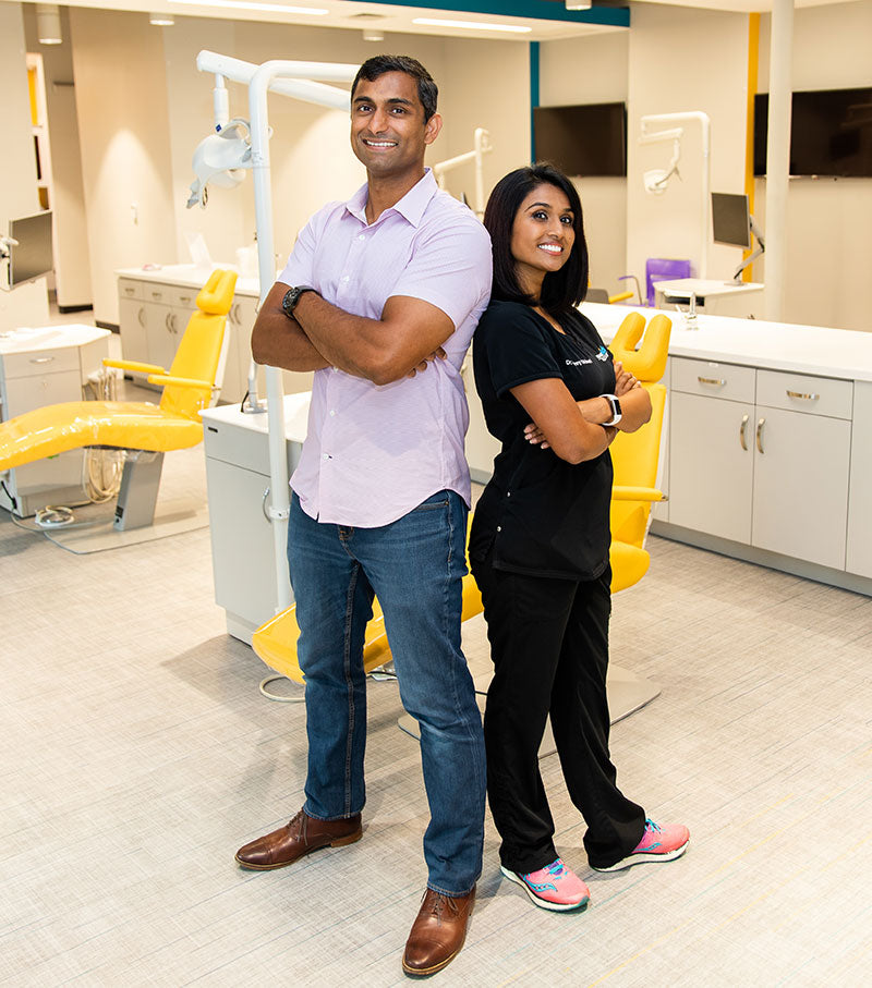Tom and Jenny smiling in modern dental clinic